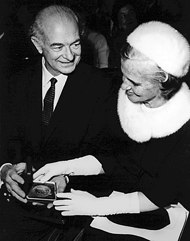 Linus and Ava examining his second Nobel medal